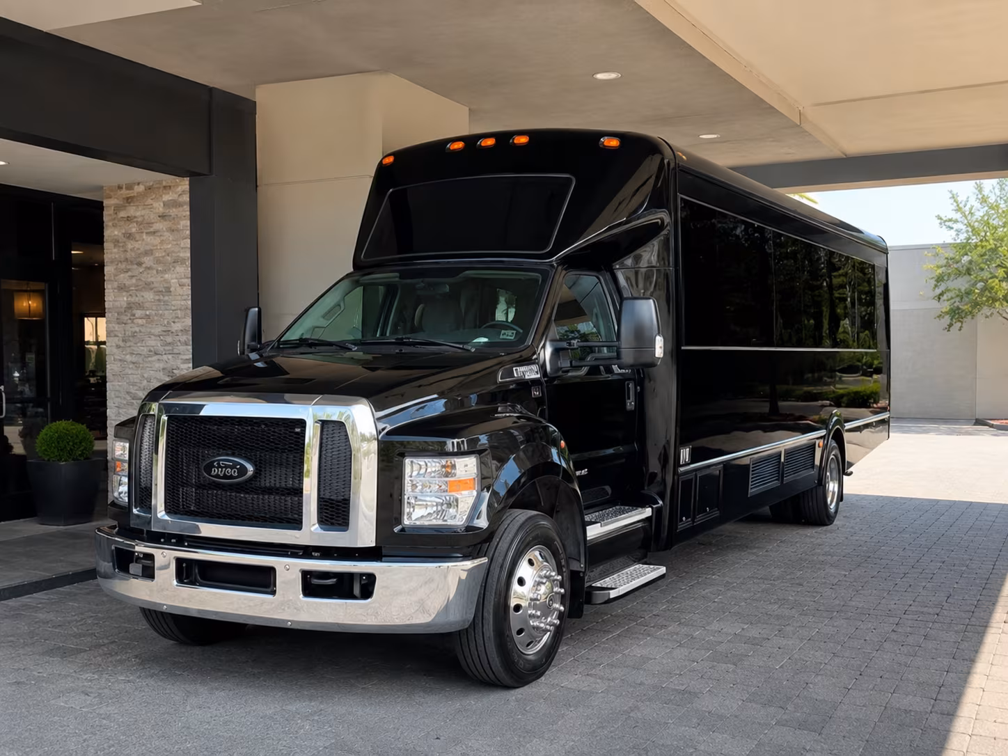 Group beside a Mercedes Sprinter limo in Clarksville